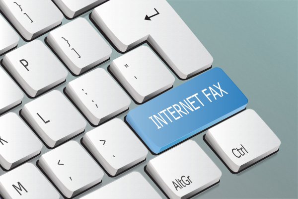 nextiva vfax review online fax service white computer keyboard blue internet fax key on keyboard